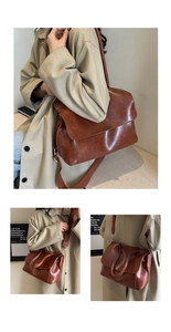 Close-up of brown vintage tote with wide shoulder strap and polished faux leather texture