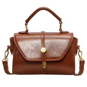 Elegant brown retro leather crossbody bag with top handle and golden buckle for women