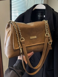Brown leather chain shoulder bag for women with gold hardware in a chic daily style