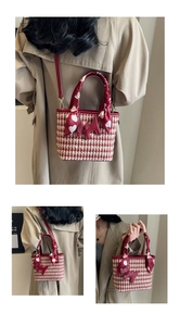 Detail of red houndstooth bridal bucket bag with heart scarf and puppy charm