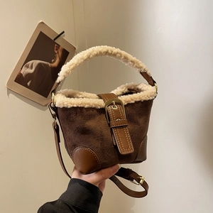 Vintage brown suede handbag with faux shearling trim and adjustable leather shoulder strap
