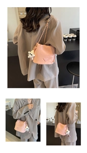 Three-way view of pink bucket bag with chain strap and cute plush sheep charm