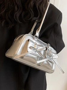 Silver metallic Y2K shoulder bag with bow details and minimalist tote design