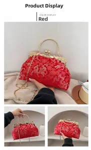 Close-up of red silk satin handbag with golden dragon and phoenix embroidery details