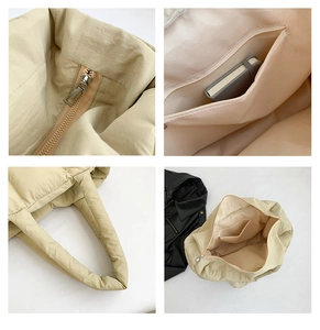 Detail of apricot padded tote bag showing metal zipper closure and interior storage pockets
