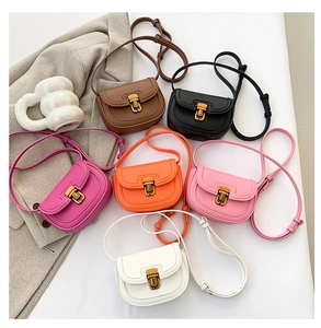 Overhead view of colorful pebble leather saddle bags with vintage gold buckles