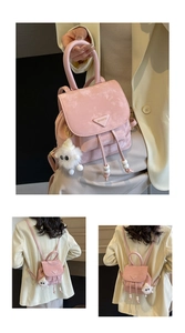 Pink mini backpack detail featuring a fuzzy sheep charm and adjustable straps for travel