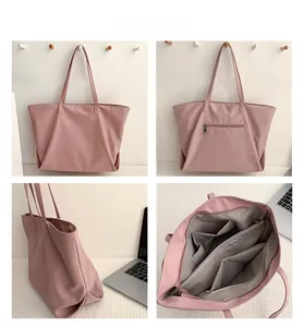 Detail view of pink nylon tote showing compartments, zipper pocket and spacious interior