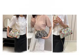 Detail of vintage floral kiss lock bag showing handbag, crossbody and shoulder options