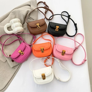 Mini saddle crossbody bags in six vibrant colors with lychee texture and gold metal locks