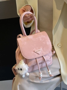 Pink minimalist faux suede backpack with metal logo and plush pendant for women