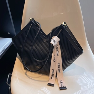 Modern black pleated PU leather tote bag with V-cut opening and fashion ribbon detail