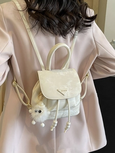 Vintage off-white mini backpack with marble texture and plush charm for women