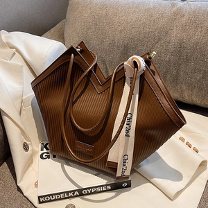 Coffee brown pleated tote bag with double handles and lettered woven shoulder strap