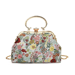 Sweet floral embroidered evening bag with gold metal handle and long chain strap