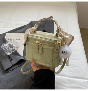 Chic light green box bag with ripple texture, heart scarf and plush pendant accessory