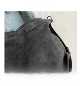 Detailed view of dark grey matte tote bag with reinforced stitching and metal D-ring buckle