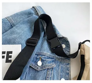 Detail view of the durable black nylon adjustable shoulder strap with plastic buckle