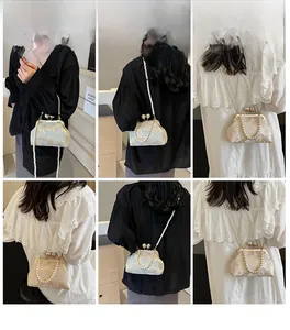Detailed views of vintage lace embroidery handbag with pearl strap on model
