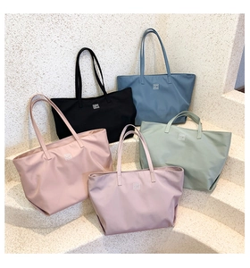 Detailed display of five color options for large capacity waterproof nylon tote bags