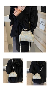 Detailed close-up of Chinese style embroidery bag with pearl clasp and vintage floral patterns