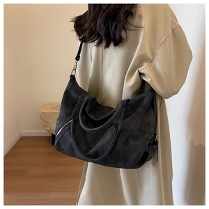 Deep grey tote bag detail showing the soft matte texture and spacious shoulder carry