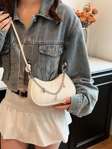 Chic white half-moon crossbody bag with textured fabric and pearl chain charms