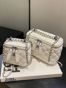 White quilted mini crossbody bag with chain strap and flower zip in two sizes