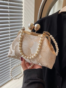 Elegant Chinese style evening bag with floral embroidery and large pearl clasp detail