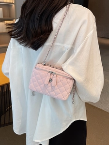 Pink quilted leather mini crossbody bag with flower charm and metal chain strap