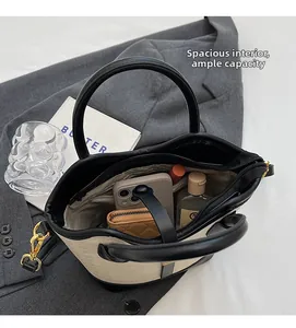 Interior view of the two-tone bucket bag showing large capacity for essentials