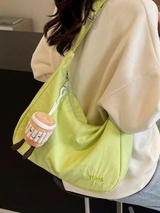Light green crescent oxford shoulder bag with Hoog embroidery and plush coffee cup charm
