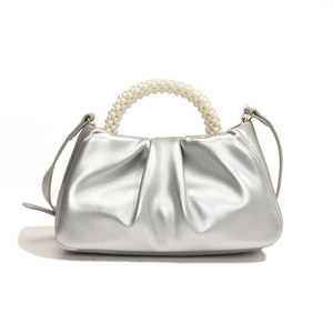Silver metallic pleated cloud bag with pearl handle and crossbody strap for women