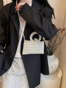 Elegant white pearl beaded mini square bag with top handle and crossbody chain strap