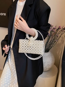 Elegant white pearl woven handbag with top handle and crossbody strap for evening wear