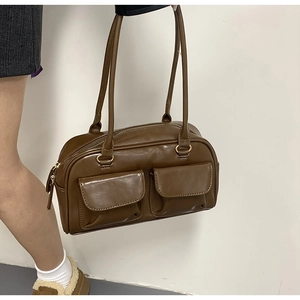 Brown PU leather shoulder bag featuring dual front pockets and glossy finish