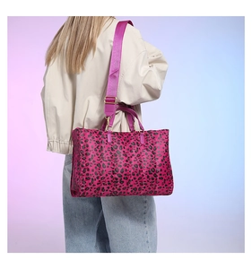 Detail of pink leopard print quilted tote bag with wide matching shoulder strap