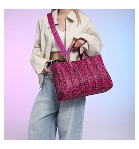 Detail of fuchsia leopard print tote bag with adjustable strap and gold hardware