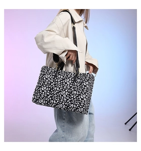 Fashionable leopard print tote bag worn with stylish casual outfit on a gradient background