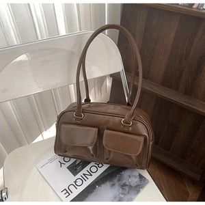Brown vintage faux leather tote bag with dual front pockets and sleek long straps