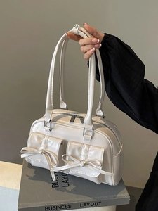 White glossy PU leather ballet bow shoulder bag with dual pockets and top handles