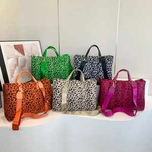 Large leopard print tote bag collection with wide straps in five vibrant colors