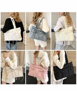 Multiple views of large tote bags with bow details and ruffled straps in six soft colors