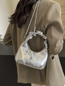 Silver textured cloud bag with pearl bow and heart charm on silver chain strap