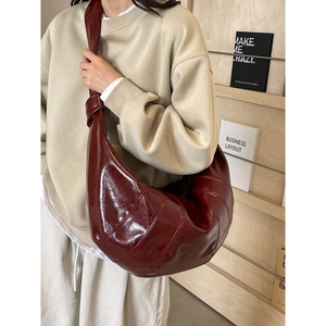 Fashionable dark red large crescent hobo bag with pleated leather and knotted strap design