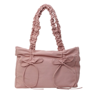 Pink pleated tote bag with decorative ribbons and bow design in soft nylon fabric