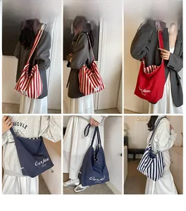 Close-up showing the soft texture and durable canvas material of striped tote bag