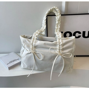 White pleated tote bag with bow ribbons and ruffled handle for women