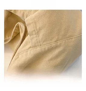 Macro shot of durable nylon fabric texture and neat stitching on this casual messenger bag