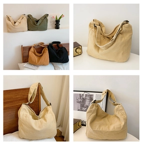 Detail view of large canvas messenger bags in four colors with adjustable wide shoulder straps